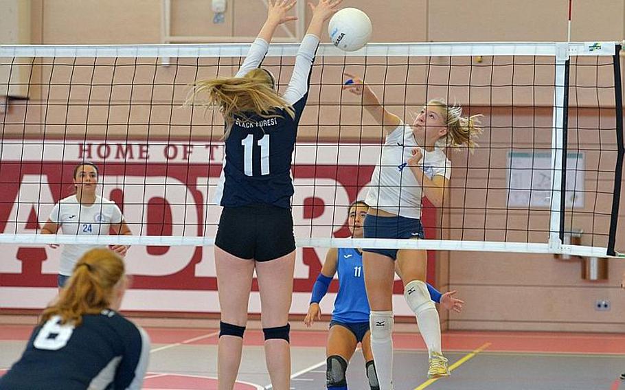 Black Forest Academy's Brooke Israel attempts to block a shot by Marymount's Luna Gulino in the Division II final at the DODEA-Europe volleyball championships in Kaiserslautern, Germany. Marymount took the title with a 24-26, 25-18, 25-21, 25-13 win.