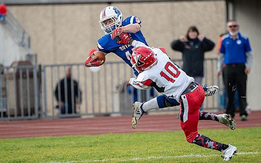 Bailey Holland is forced out of bounds by Cedric Ellis during the Ramstein vs Kaiserslautern football game at Ramstein, Germany, Saturday, Oct. 27, 2018.

Brian Ferguson/Stars and Stripes