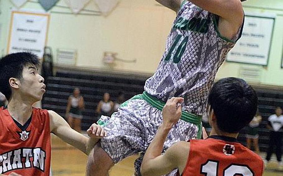Junior Jonathan Hoppe is in his third season in Kubasaki Dragons boys basketball uniform.