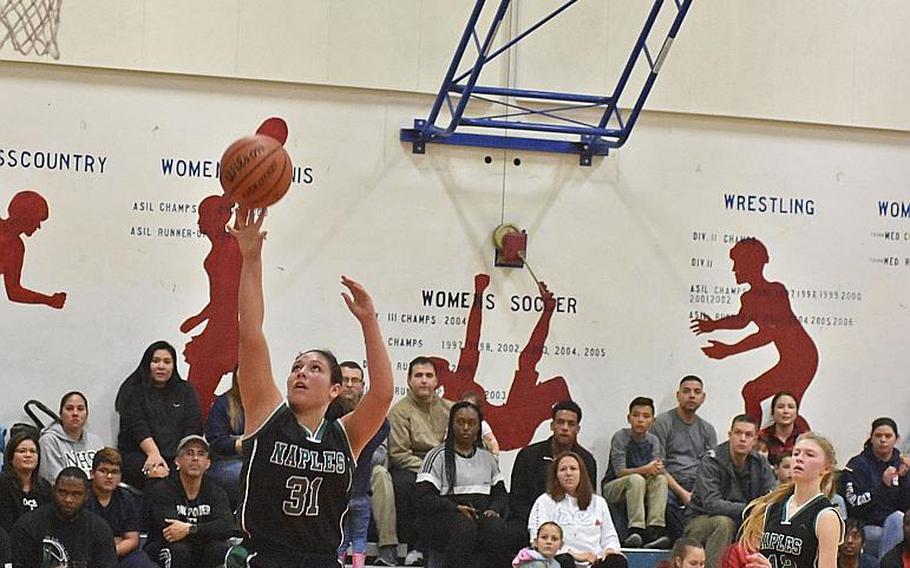 Naples' Genesis Mendez scores two of her 10 points on Friday, Feb. 1, 2019, in the Wildcats' 58-29 victory over the Aviano Saints.