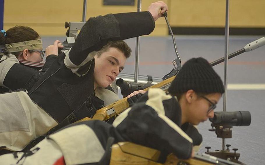 Competitors adjust and reload their air rifles while competing in the 2019 European Marksmanship Championships, in Wiesbaden, Germany, Saturday, Feb 2, 2019.