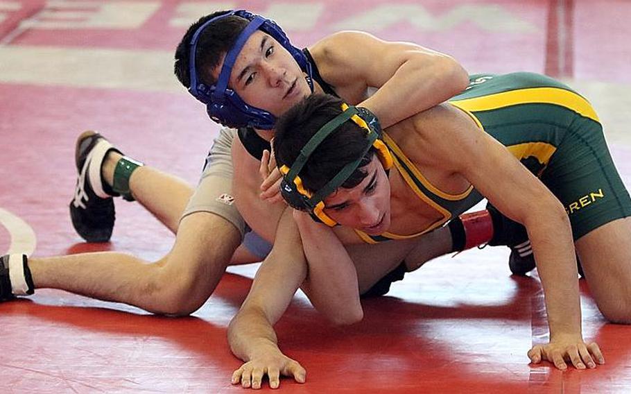 Osan senior Kojiro VanHoose, top, wrestling Sam Squires of Robert D. Edgren in the Far East 129-pound final, has been named Stars and Stripes Pacific's high school wrestling Athlete of the Year.