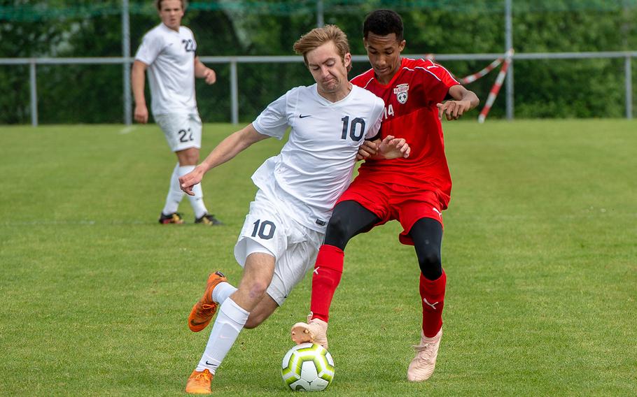 Lakenheath's Freedom Scott Tansley and Kaiserslautern's Elijah Daniels battle for control go the ball during the first day of the DODEA-Europe soccer championships, Monday, May 20, 2019.