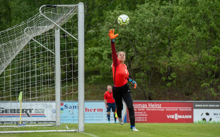 Wiesbaden goalkeeper Karli Wallace reaches for the ball during a game against Naples on the first day of the DODEA-Europe soccer championships, Monday, May 20, 2019.