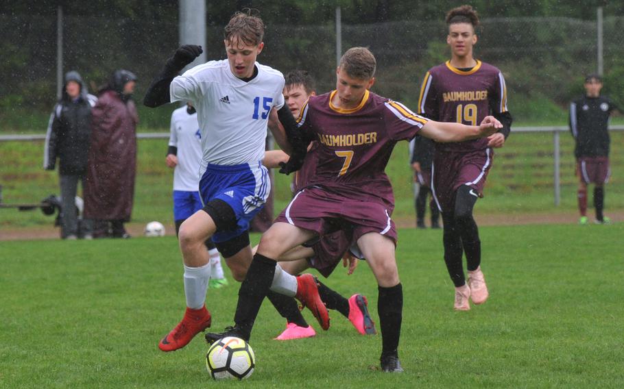 Dennis Yusofoff of Hohenfels gets past Baumholder defender Noel King on his way to scoring a goal in the Tigers' 7-0 win over the Bucs in a Division III game in Landstuhl, Tuesday, May 21, 2019.