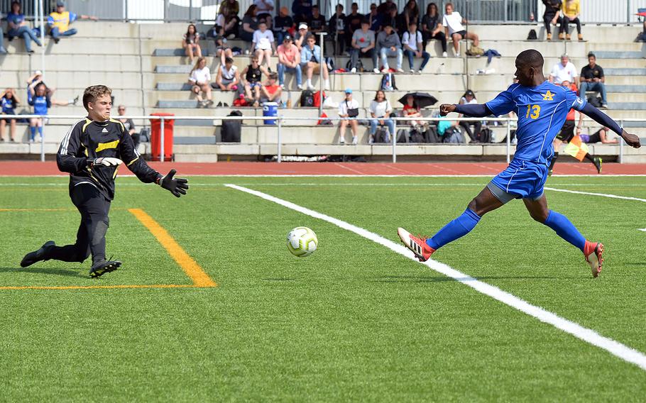 Sigonella keeper Chad Todd makes a stop on Ansbach's Kevin Kamara in the boys Division III final at the DODEA-Europe soccer championships in Kaiserslautern, Germany, Thursday, May 23, 2019. Kamara later scored both of his team's goals in the Cougars' 2-1 victory.