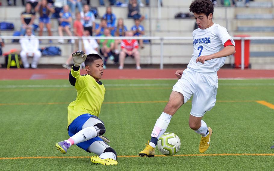Ansbach keeper Rovic Denuna goes against Sigonella's Anthony Cassar in the box. Cassar drew a penalty that led to his team's only goal in a 2-1 loss to the Cougars in the Division III boys final at the DODEA-Europe soccer championships in Kaiserslautern, Thursday, May 23, 2019.