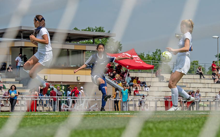 BFA's Yewon Park crosses the ball to the center of the field during the girls Division II DODEA-Europe soccer championship game against Marymount, Thursday, May 23, 2019. BFA won the game 5-0. 