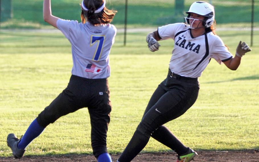 Yokota shortstop Elena Haas fields the ball as Zama's Litzie Figueroa arrives at second base during Thursday's playoff game in the Far East Division II softball tournament. The Panthers won 14-2.