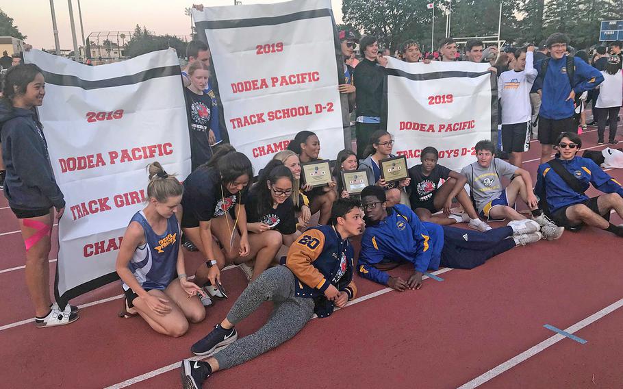 Yokota shows off its banners following its sweep of the Far East Division II track and field meet titles.