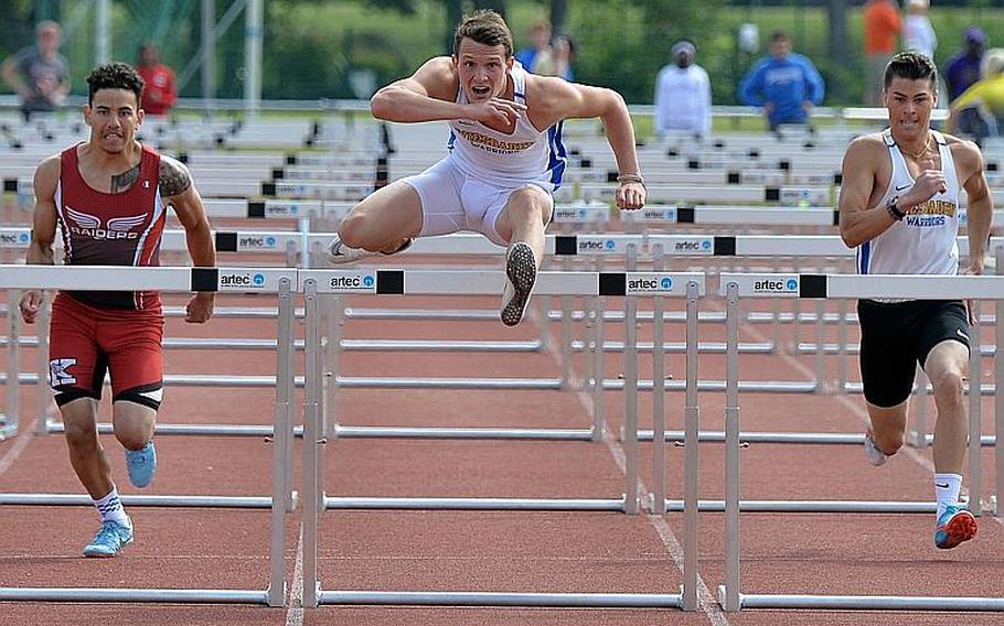 Wiesbaden's Garett Armel has his eyes on the finish line as he clears the final hurdle in the 110-meter hurdle race at the DODEA-Europe track and field finals in Kaiserslautern, Saturday, May 25, 2019. He won in 15.16 seconds ahead Kaiserslautern's Alapae Turgeon, left. Callum Wallace, at right, finished fifth.
