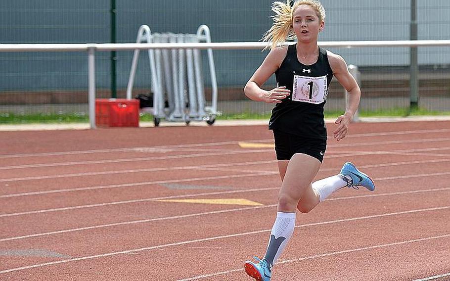 Stuttgart's McKinley Fielding runs alone after outpacing the competition on her way to winning the the 3,200-meter race in a new DODEA-Europe record of 11 minutes, 7.78 seconds, beating the old record by almost 20 seconds on Saturday, May 25, 2019. A day earlier she also broke the record in the 1,600.
