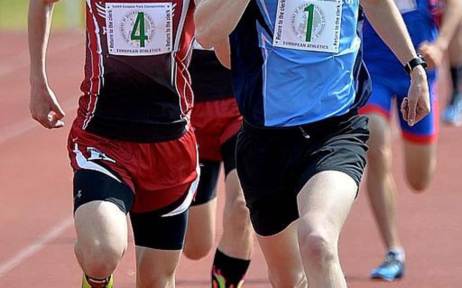 Black Forest Academy's Mac Roberts leads Kaiserslautern's Joseph Purvis to the finish line in the 1,600-meter run, winning in 4 minutes, 30.22 seconds at the DODEA-Europe track and field finals in Kaiserslautern, Saturday, May 25, 2019.