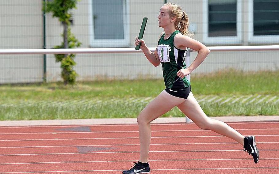 Naples' Alyssa McKamey anchors her team's victory in the 1,600-meter sprint medley at the DODEA-Europe track and field finals in Kaiserslautern, Saturday, May 25, 2019. The Wildcats took the 2019 title with a run of 4 minutes, 32.26 seconds.