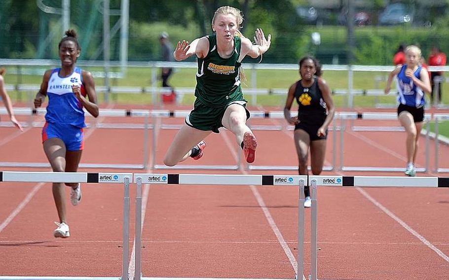 Alconbury's Marissa Kastler clears the final hurdle on her way to winning the 300-meter hurdle event at the DODEA-Europe track and field finals in 48.62 seconds.