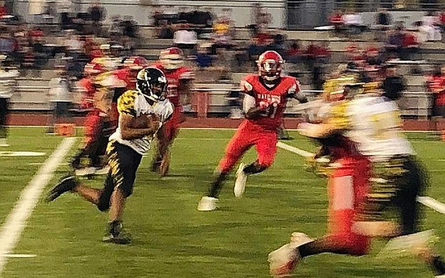 Stuttgart running back Trent Jackson picks up yardage in the Panthers' 30-6 defeat of the Kaiserslautern Raiders on Friday, Sept. 13, 2019, at Kaiserslautern High School.