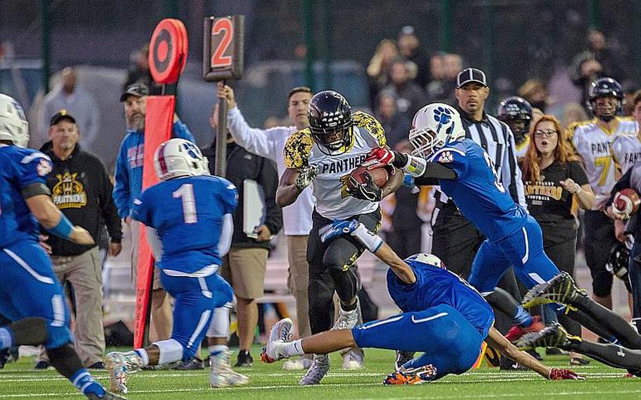 Jordan McCullough tries to break free from tacklers during a game between Ramstein and Stuttgart at Ramstein High School, Friday, Sept.  27, 2019. Stuttgart won the game 37-17.

Brian Ferguson/Stars and Stripes