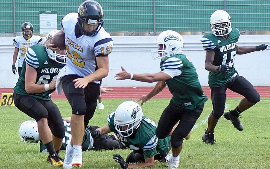 Vicenza Cougars quarterback Lucas Ridgley breaks several tackles from smaller Naples Wildcats on Saturday, Sept. 7, 2019 at Naples. 