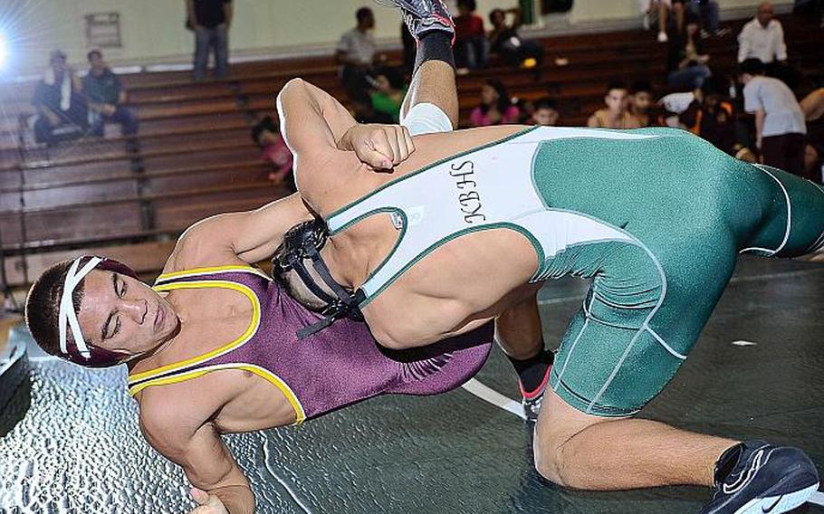 After seven years on the shelf, the Rumble on the Rock wrestling tournament is back on the Okinawa mats for its seventh iteration. Here in the last Rumble held in February 2013, Micah Lopez of Guam's Father Duenas gets thrown to the mat by Kubasaki's Sho Green in a 158-pound bout.