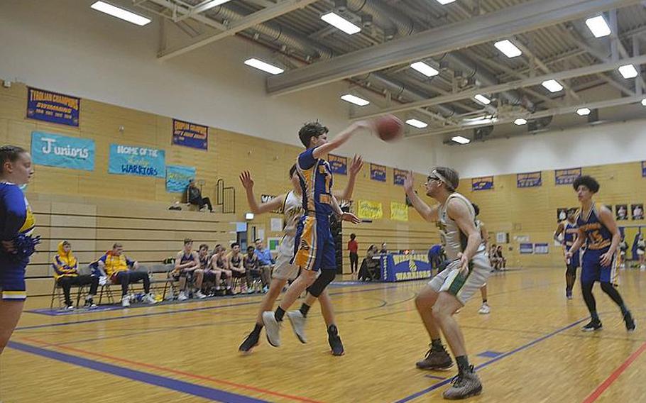 Wiesbaden’s Levi Ferguson passes the ball to a teammate during a game against SHAPE. The Warriors beat the Spartans 61-35. 