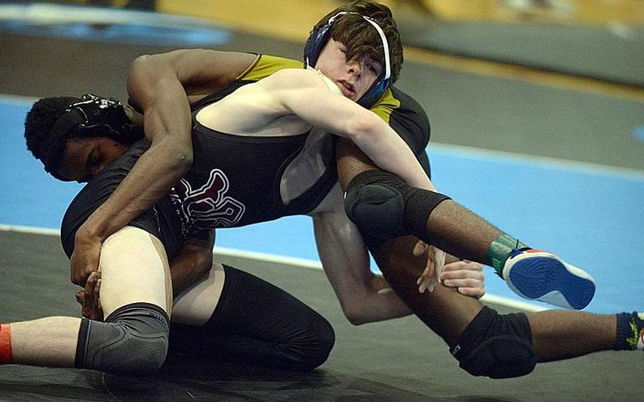 Matthew C. Perry's Marcus Irons beats Humphreys' DeShawn Adkins by pin at 122 pounds on the opening day of the Far East Wrestling Championships.