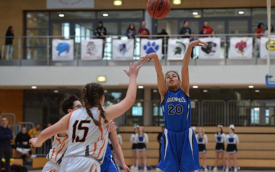 Jania Vicente of Hohenfels gets off a shot over Emerson Retka of Spangdahlem in the girls Division III final at the DODEA-Europe basketball championships in Wiesbaden, Germany, Saturday, Feb. 22, 2020. Spangdahlem won 37-21.