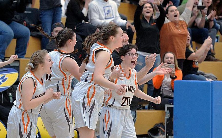 The Spangdahlem Sentinels celebrate their girls Division III title after defeating Hohenfels 37-21 at the DODEA-Europe basketball championships in Wiesbaden, Germany, Saturday, Feb. 22, 2020. Spangdahlem won 37-21.