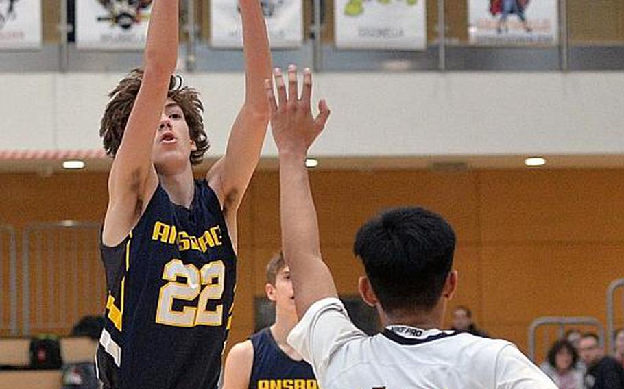 Alexander Adams of Ansbach scores over Isaiah Daep of Baumholder in the boys Division III championship game at the DODEA-Europe basketball finals in Wiesbaden, Germany, Saturday, Feb. 22, 2020. Baumholder won its third title in a row with a 50-43 win.