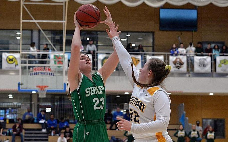 Elena Vascos-Lavere of SHAPE shoots over Rachel Johnson of Stuttgart in the girls Division I final at the DODEA-Europe basketball championships in Wiesbaden, Germany, Saturday, Feb. 22, 2020.