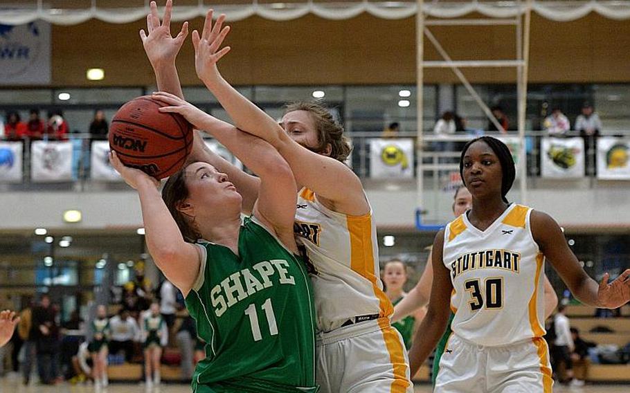 Rachel Baker of Stuttgart tries to keep McKenzie Barden from shooting in the girls Division I final at the DODEA-Europe basketball championships in Wiesbaden, Germany, Saturday, Feb. 22, 2020.