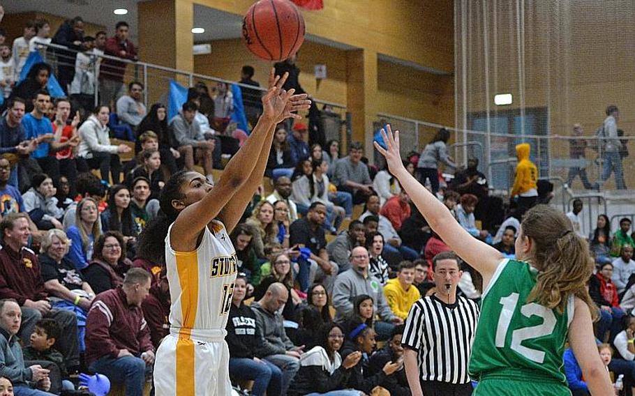 Jaelyn Page of Stuttgart shoots as Claudia Commi of SHAPE defends in the girls Division I final at the DODEA-Europe basketball championships in Wiesbaden, Germany, Saturday, Feb. 22, 2020.