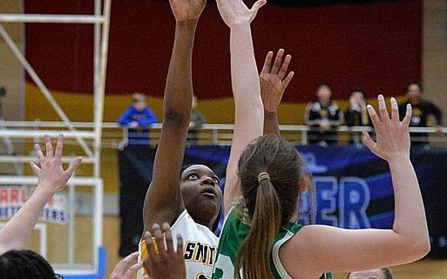 Jaela Ashley of Stuttgart shoots over Elena Vassos-Lavere  in the girls Division I final at the DODEA-Europe basketball championships in Wiesbaden, Germany, Saturday, Feb. 22, 2020.