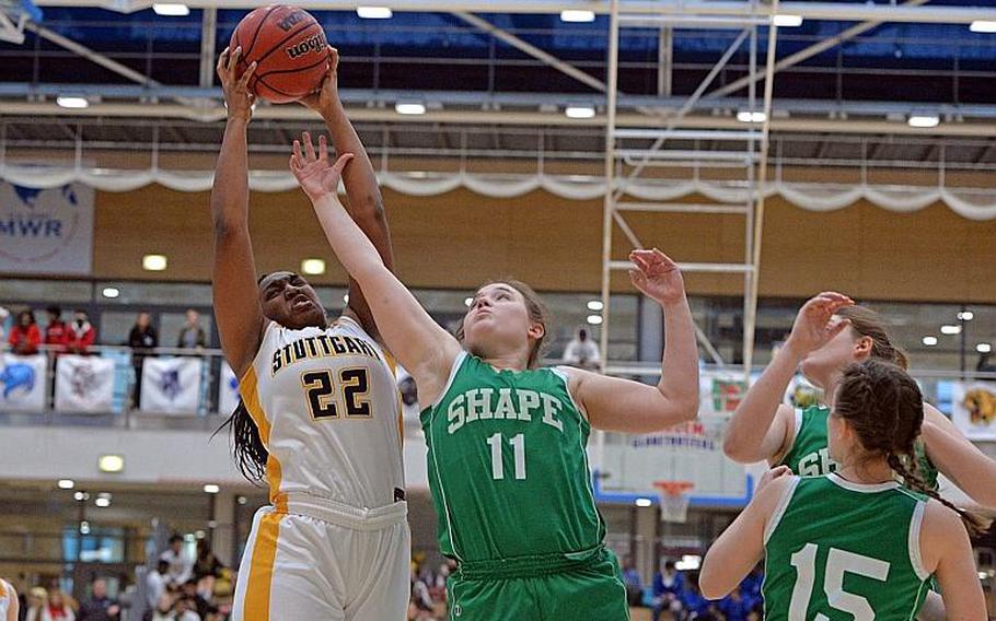 Skye DaSilva Matis of Stuttgart pulls down a rebound against McKenzie Barden of SHAPE in the girls Division I final at the DODEA-Europe basketball championships in Wiesbaden, Germany, Saturday, Feb. 22, 2020.