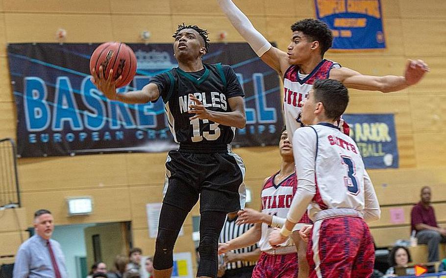 Naples' Mark Simmons goes in for a lay-up during the DODEA-Europe 2020 Division II Boys Basketball Championship game against Aviano at Wiesbaden High School, Germany, Saturday, Feb. 22, 2020. Naples won the game 40-35.