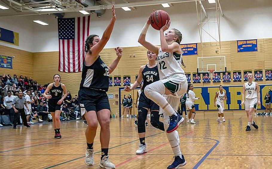 Naples' Roxanne Sasse drives to the basket during the DODEA-Europe 2020 Division II Girls Basketball Championship game against Vicenza at the Wiesbaden High School, Germany, Saturday, Feb. 22, 2020. Naples won the game 44-35.