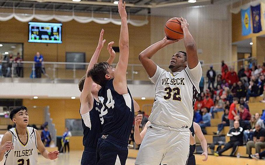 Jonas Matthews of Vilseck gets a shot off against Black Forest Academy in a boys Division I semifinal at the DODEA-Europe basketball championships in Wiesbaden, Germany, in February.
MICHAEL ABRAMS/STARS AND STRIPES