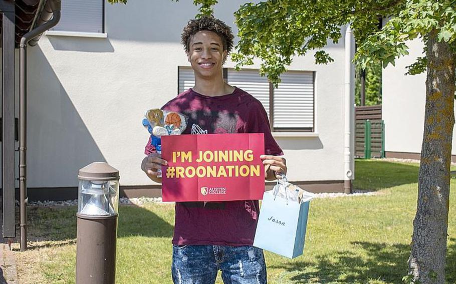 Ramstein High School senior Jason Jones Jr. celebrates signing with NCAA college basketball program Austin College.