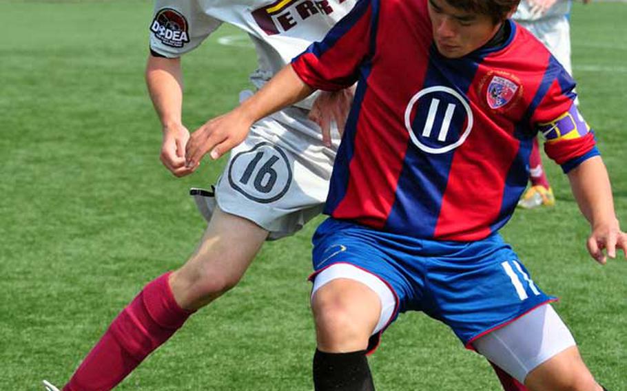 Matthew C. Perry Samurai's Kody Botts and International Christian-Uijongbu's Dong Kyu Kim battle for the ball during Monday's pool-play match in the 2011 Far East High School Boys Division II Soccer Tournament at Camp Humphreys, South Korea.