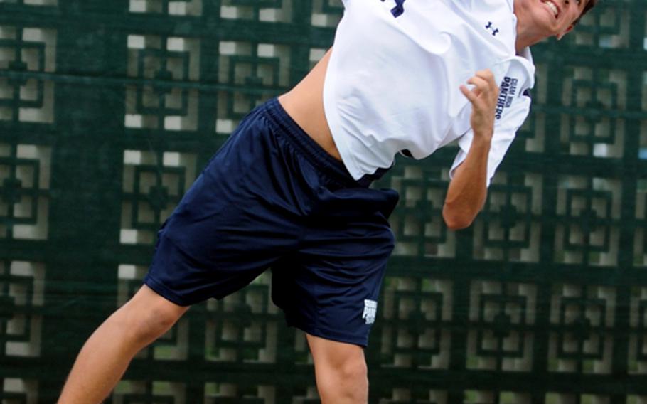 Brandon Lumaban of Guam High serves against Adam Sobieck of E.J. King during the first-round boys singles match in the 2011 Far East High School Tennis Tournament at Risner Tennis Complex, Kadena Air Base, Okinawa on Monday, Nov. 7, 2011. Lumaban edged Sobieck 8-6 and advanced to Tuesday's Round of 16 match against DODDS Japan champion Sam Cadavos of Matthew C. Perry.