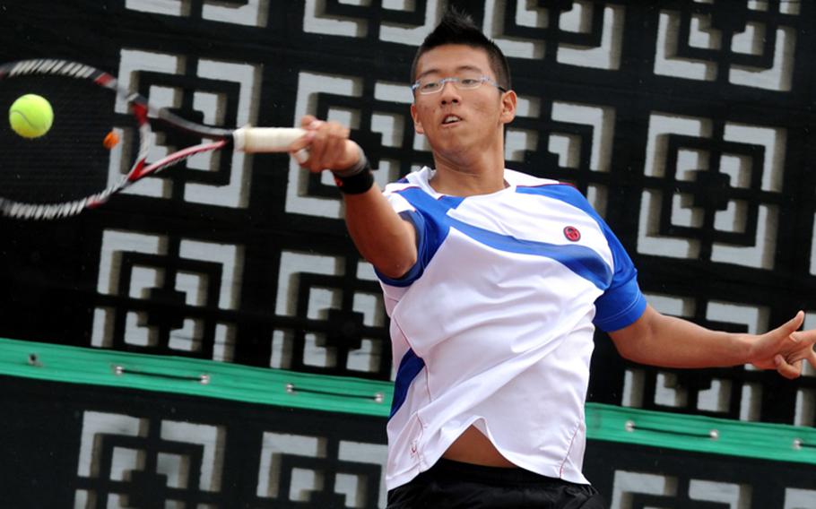 Seoul American's Russell Midomaru slams a forehand volley against Taishi Misumi of St. Mary's International during the boys singles quarterfinal in the 2011 Far East High School Tennis Tournament at Risner Tennis Complex, Kadena Air Base, Okinawa on Nov. 8, 2011. Midomaru won 8-4.
