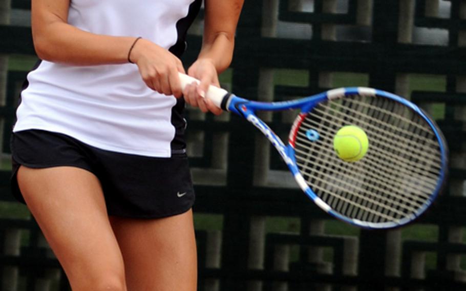 Kadena's Erika Youngdahl smacks a backhand return against Yokota's Emily Beemsterboer during the girls singles quarterfinal in the 2011 Far East High School Tennis Tournament at Risner Tennis Complex, Kadena Air Base, Okinawa on Nov. 8, 2011. Youngdahl won 8-3.