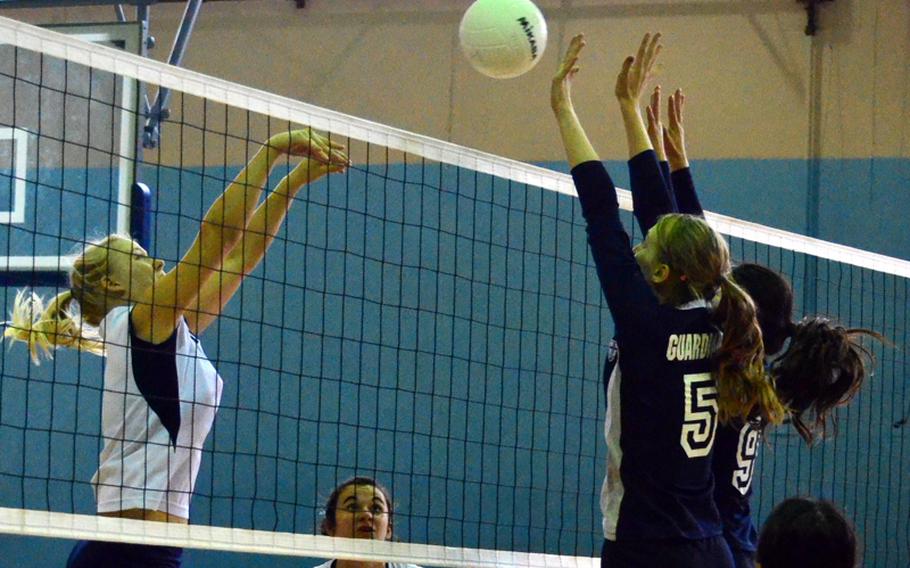 Ilona Heiskanos of Morrison Academy tries to push a shot through the double block of Yongsan International-Seoul's Sarah Waldrop and Sarah Kim during Tuesday's pool-play match in the 2011 Far East High School Girls Division II  Volleyball Tournament at Camp Walker, South Korea. Morrison beat YIS-Seoul in straight sets.