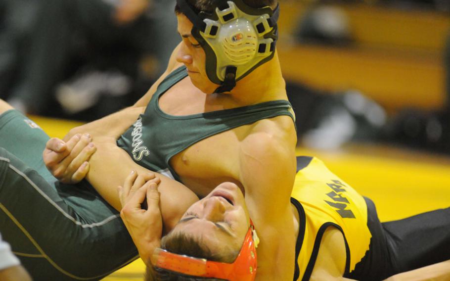 Kubasaki 108-pounder and reigning Far East Tournament weight-class champion Steven Walter gets the upper hand on Kadena's David Hernandez during Wednesday's Okinawa Activities Council wrestling season-opening dual meet at Kadena High School, Okinawa. Walter pinned Hernandez in 2 minutes, 36 seconds and Kubasaki won the dual meet 41-20.