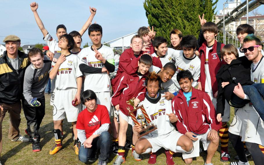 Matthew C. Perry Samurai players and coach Mark Lange, left, celebrate after the Perry Cup match at Matthew C. Perry High School on March 3, 2012, at Marine Corps Air Station Iwakuni, Japan. The Samurai won all three of their matches, outscoring their opponents 16-1.