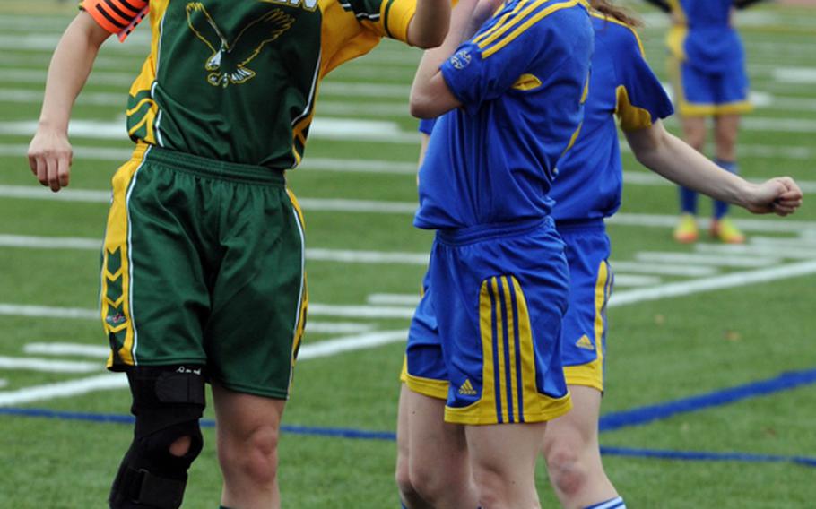 Robert D. Edgren senior midfielder Jen Black, left, heads the ball in front of Yokota's Christina Raymond during Thursday's DODDS Japan girls soccer tournament at newly dedicated, field-turfed Bonk Field, Yokota Air Base. The Panthers blanked the Eagles 5-0.