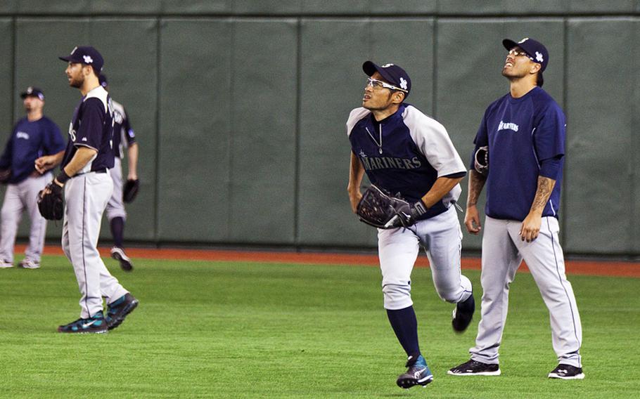 Seattle Mariners right fielder Ichiro Suzuki, fields a fly ball during practice Saturday at the Tokyo Dome in Tokyo.
