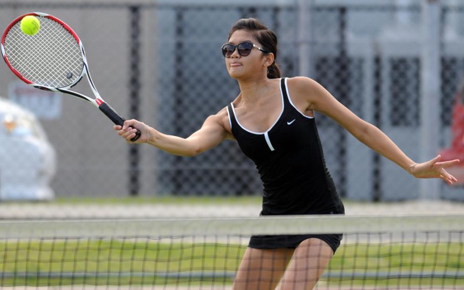 Zama American Trojans No. 1 girls tennis singles seed Natalie Burke smacks a forehand volley against Rachel Tyo of Robert D. Edgren Eagles during the DODDS Japan tennis tie at Zama American High School in Japan on Oct. 20, 2012. Burke won 8-3 and Zama's girls won 2-1.