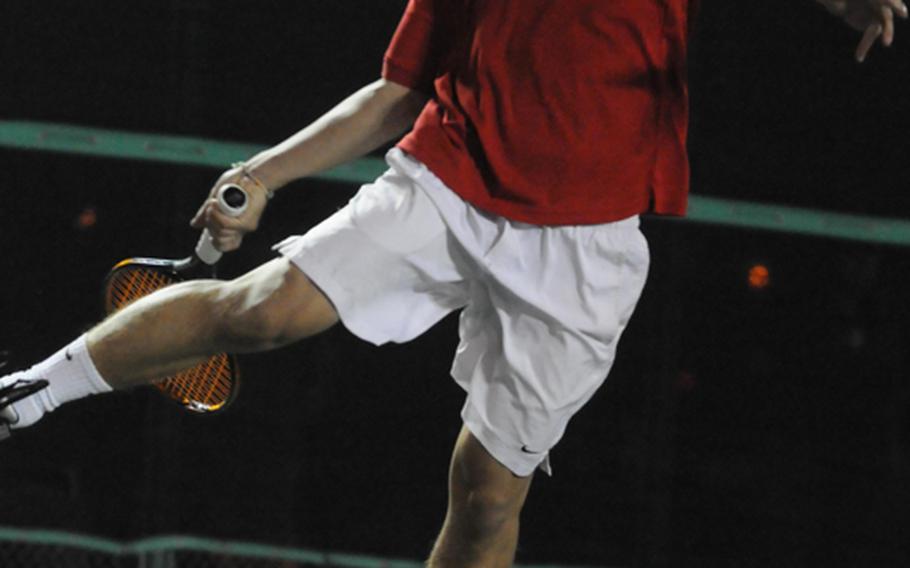 Junior Kei Tokeshi of Okinawa Christian School International prepares to smash a forehand volley against Dale Tubat of Kubasaki in the boys final in the Okinawa Activities Council district singles tennis tournament Oct. 29, 2012, at Kadena Air Base Okinawa. Tokeshi became the first OCSI player to win both a doubles and singles OAC district title, beating Tubat 8-0 five days after winning the district doubles title with teammate James Durham.