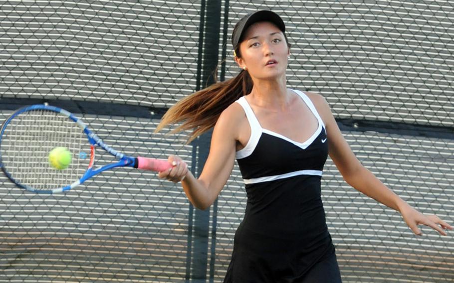 Senior Erika Youngdahl, of Kadena, slaps a forehand groundstroke against Okinawa Christian School International's Catherine Funakoshi during the girls semifinal in the Okinawa Activities Council district singles tennis tournament Oct. 29, 2012, at Kadena Air Base Okinawa. Youngdahl won 8-4, then went on to win her third straight district gold, beating teammate Kristin Howard 9-8 (7-5).