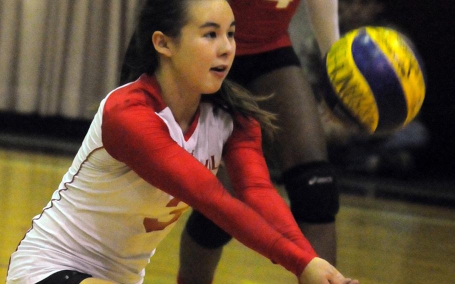 Nile C. Kinnick Red Devils libero Kaile Johnson bumps the ball against the Seisen International Phoenix  during Tuesday's Kanto Plain Association of Secondary Schools girls volleyball match at the Phoenix Center, Seisen International School, Tokyo.